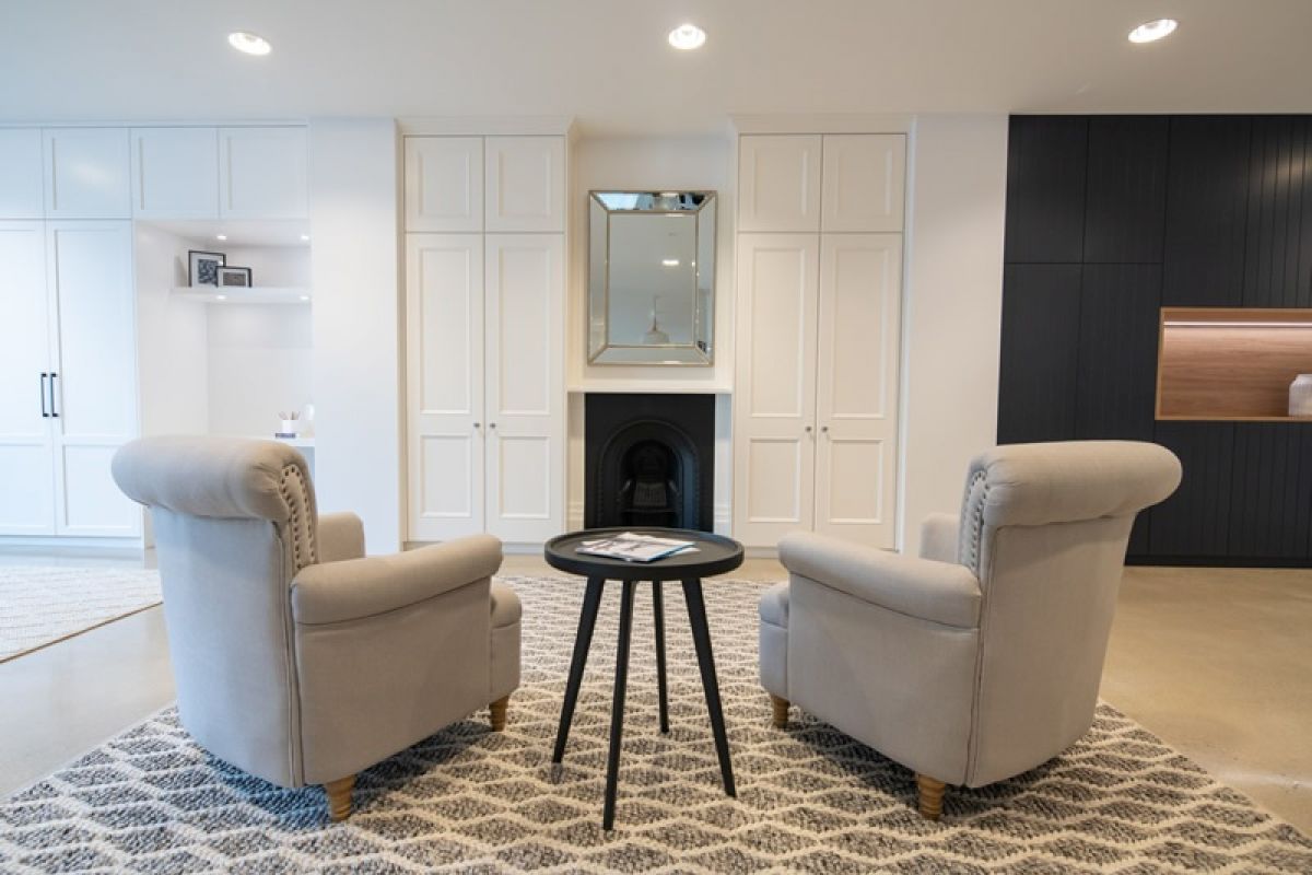 Twin Oxford built-ins with hinged doors in living area