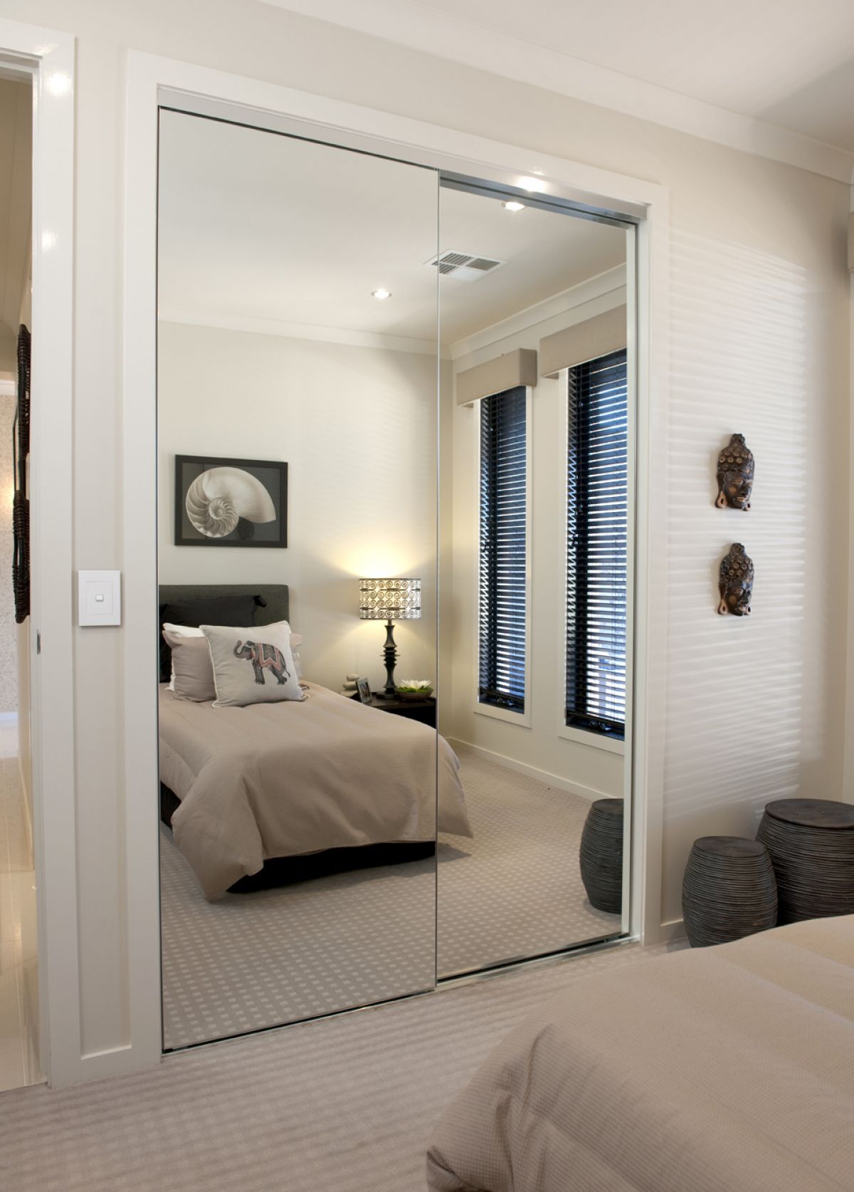 Twin mirrored sliding doors on Portsea built-in wardrobe