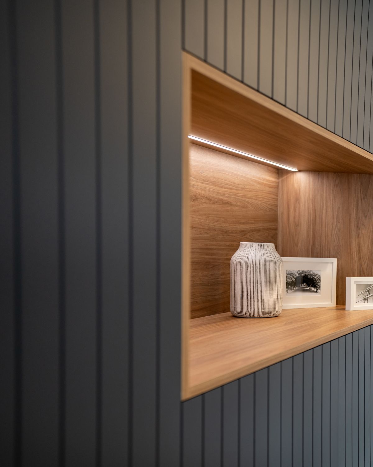 Close-up of hinged door Sorrento wardrobe with built-in display shelf