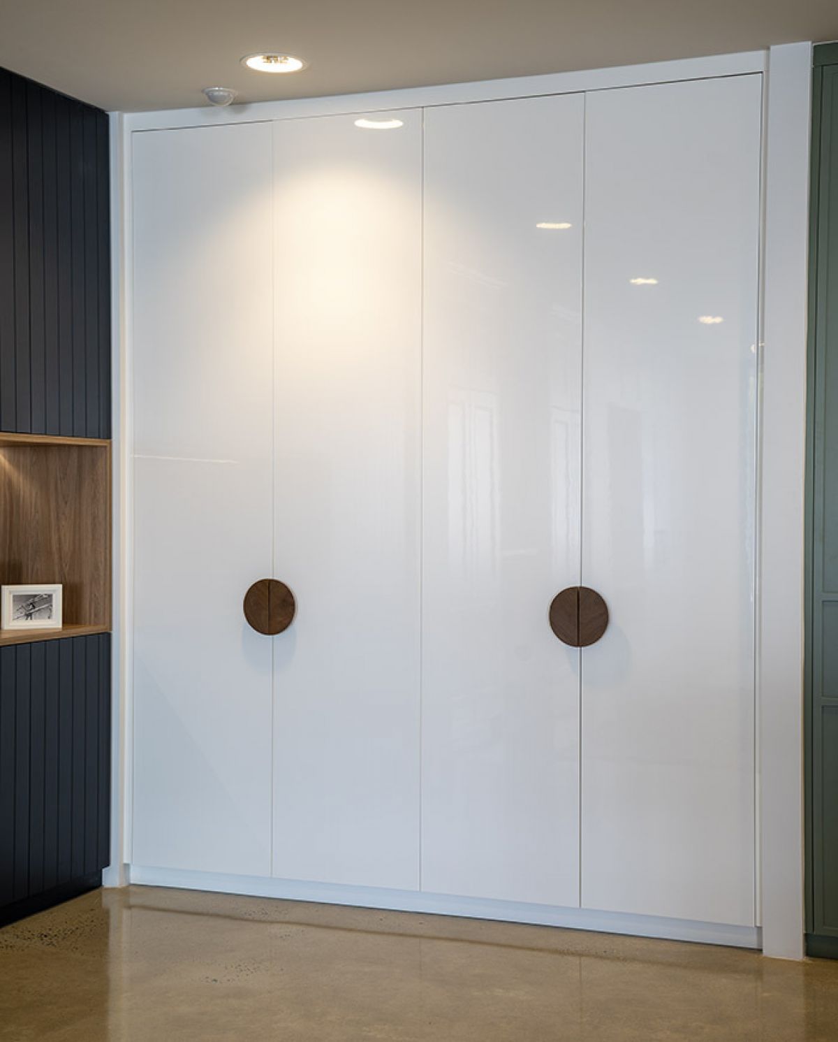 Timber built-in wardrobe with modern round handles