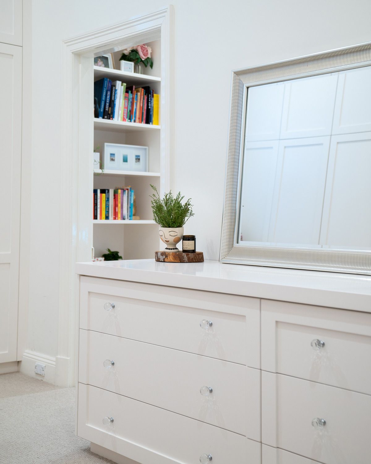 Boston style built-in dresser with knobs that match decor
