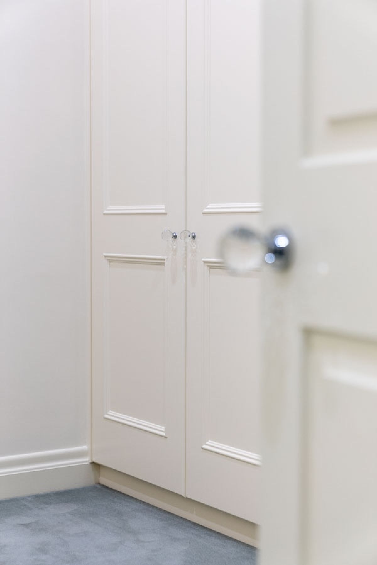 Matching door knobs on Oxford hinged door built-in wardrobe