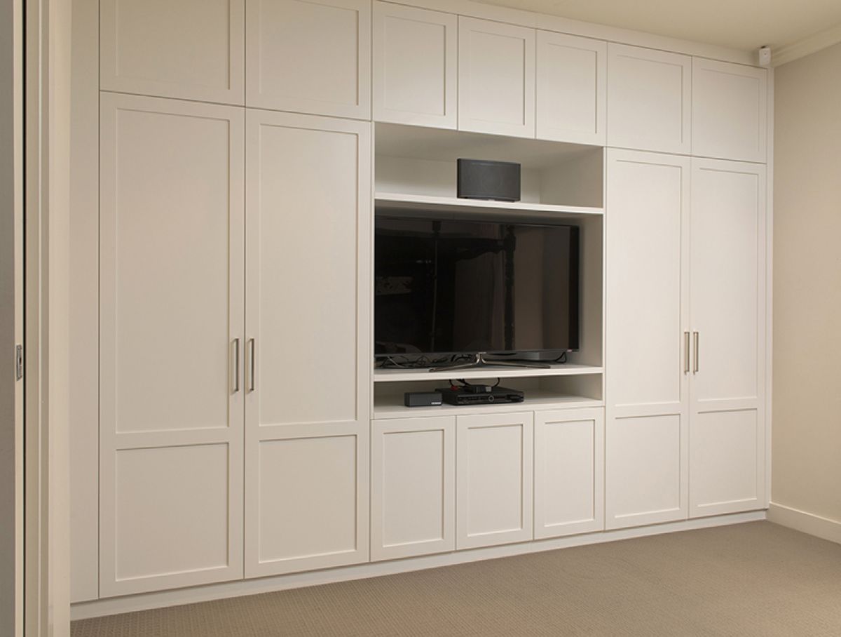 Wall to wall, full height Boston built-in wardrobe with inset entertainment space