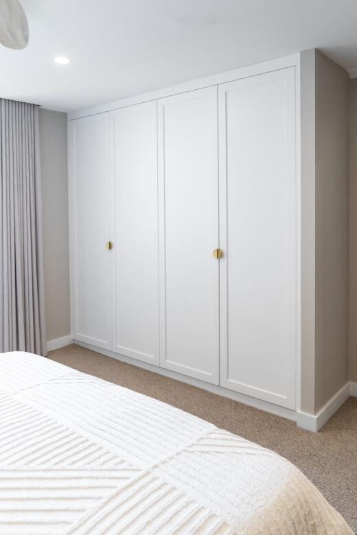 Single-panel Boston floor-to-ceiling wardrobe in Dulux Vivid White 2-pack satin finish, featuring a custom minimalist built-in design by Packers.