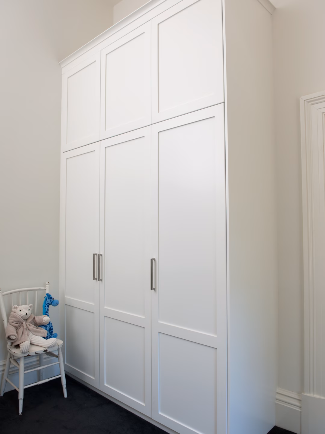 Two-panel Boston wardrobe in Dulux Natural White 2-pack satin finish, featuring a classic scotia cornice for a custom built-in aesthetic.