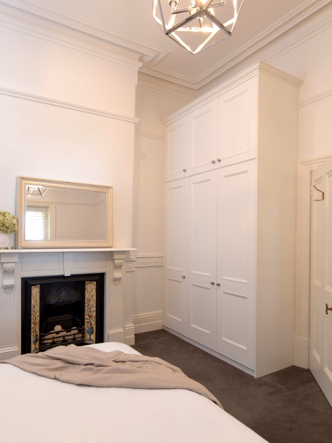 Traditional two-panel Oxford wardrobe in Dulux Vivid White 2-pack satin finish, featuring a classic colonial cornice and custom built-in cabinetry by Packers.