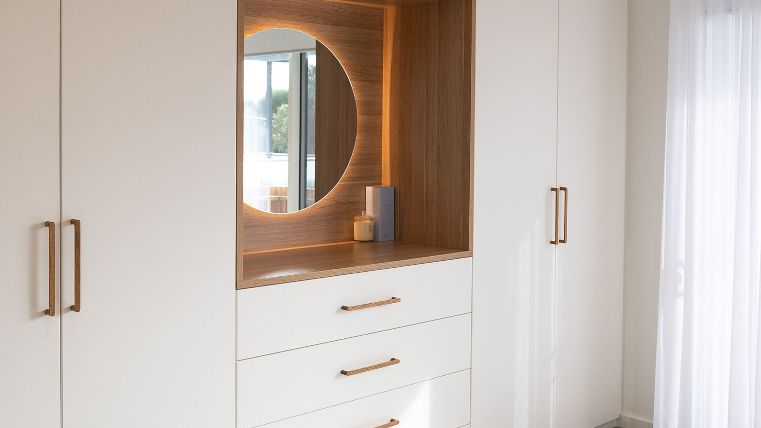 Modern Sorrento wardrobe and dresser in Vivid White 2-pack satin, featuring a back-lit LED mirror, exposed drawers, and a Polytec Natural Oak Matt benchtop with Kethy Pinta oak handles.