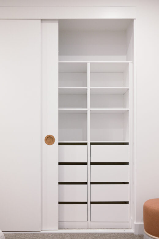 Custom Waterford sliding wardrobe in Polytec Polar White featuring an integrated double drawer unit for maximised internal storage, precision-built by Packers.