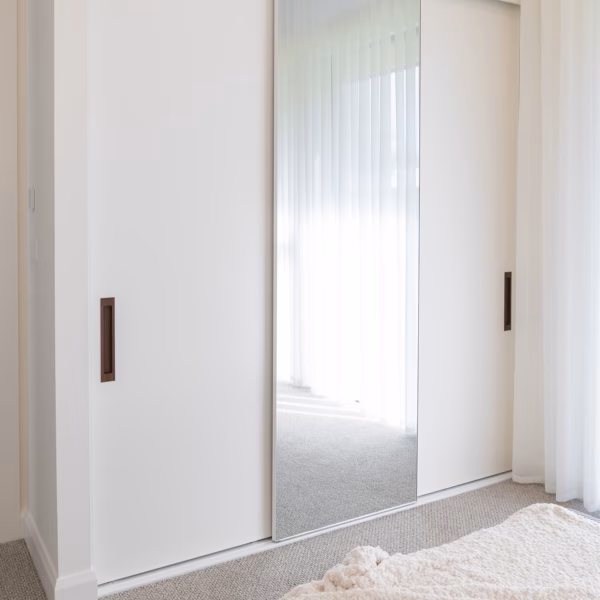 Premium three-door wardrobe featuring two Waterford doors in Dulux Natural White 2 Pack Satin finish and a Portsea mirrored door with a slimline white frame, custom-built by Packers.