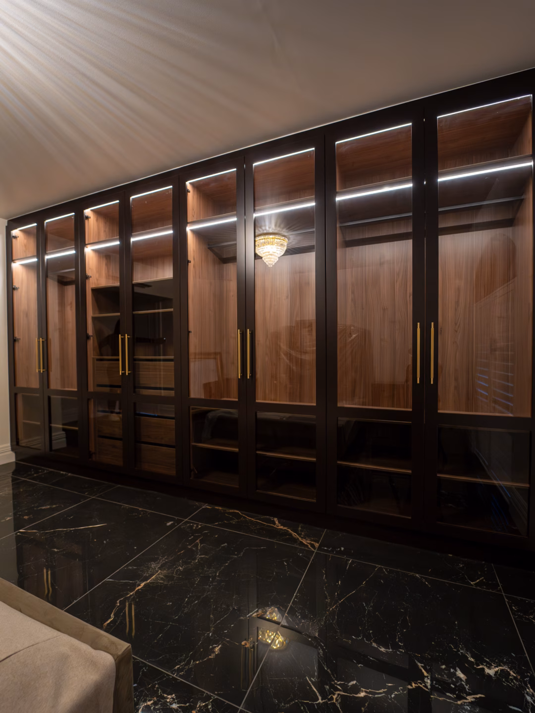 Premium Boston two-panel wardrobe doors in Dulux Luck 2 Pack Satin with grey glass inserts, featuring Lo & Co Linear brass handles and integrated Häfele LED lighting by Packers.